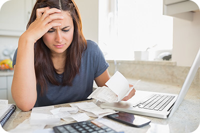 Woman Looking at Bills