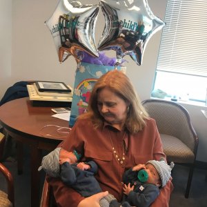 Adoption Agency Director Parker Herring and the twins